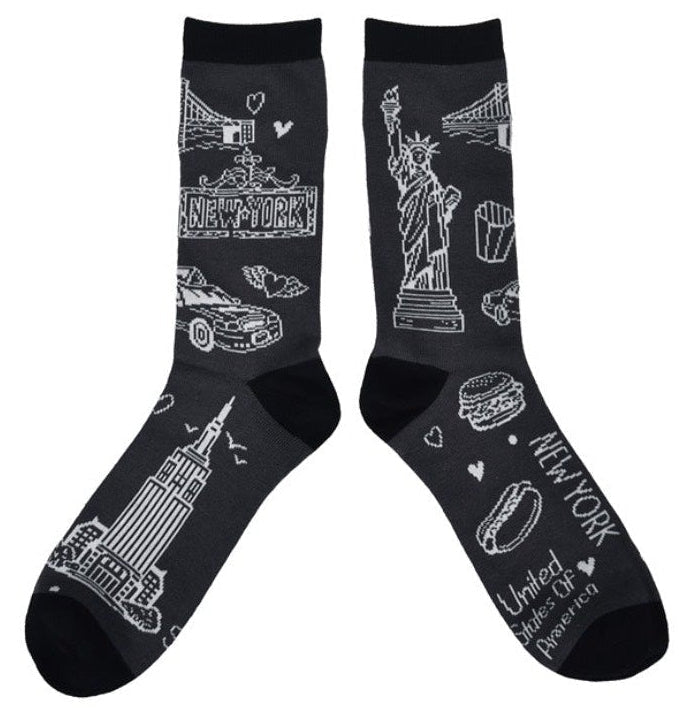 Pair of socks with white illustrations of NYC icons on a black background.