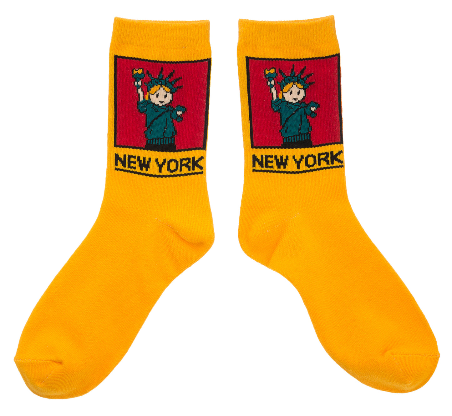 NYC Cartoon Statue of Liberty Socks
These yellow crew socks feature a soft, woven cartoon image of the Statue of Liberty. On the ankle is a square red panel outlined in black, containing a friendly aqua-green Lady Liberty with small orange details in her hair and torch flame. Below the panel, “NEW YORK” appears in large, bold lettering in black. The socks feel smooth and flexible, made for comfortable everyday wear with playful New York character.