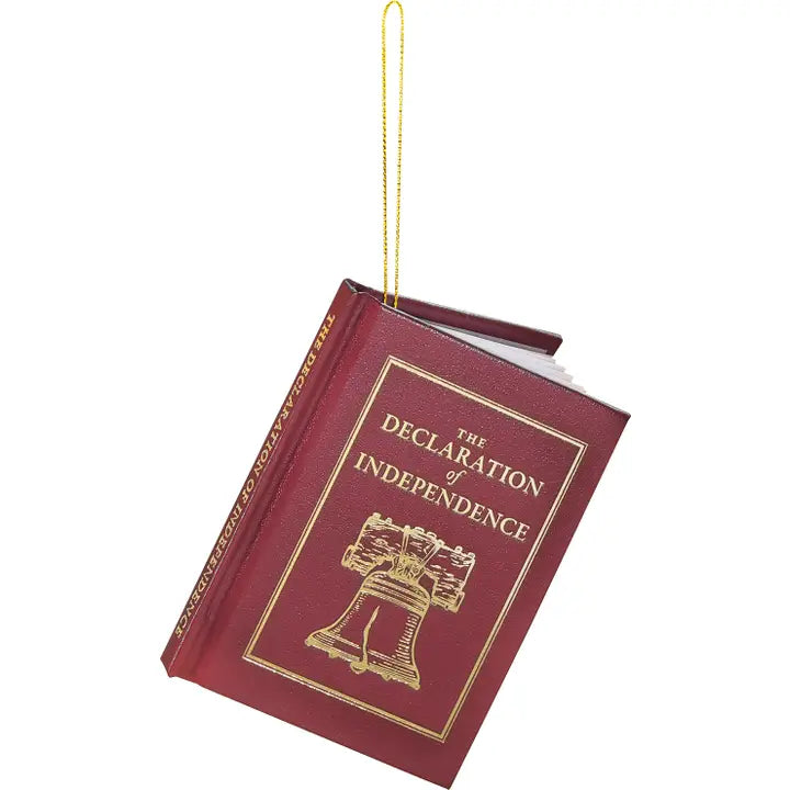 A miniature book-shaped ornament representing 'The Declaration of Independence' with a gold hanging loop, shown on a plain white background.
