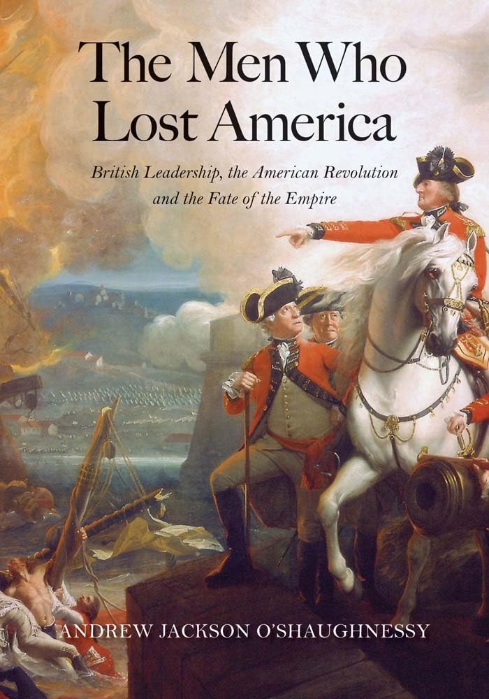The cover shows high‑ranking British military figures in red uniforms on the right, set against a smoky countryside battlefield with tents and a distant village. Cannon fire clouds the scene, and fallen soldiers in the foreground suggest the human cost of war. The title, The Men Who Lost America, appears near the top in blue, with the subtitle beneath it, and the author’s name, Andrew Jackson O’Shaughnessy, centered at the bottom in white.