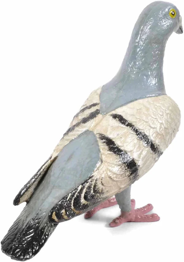 Features a solid cast iron pigeon figurine shown from behind at a three-quarter angle, hand-painted in soft shades of grayish blue, white, and black, with a lightly distressed finish that gives it a vintage look; each piece is individually hand-finished, so slight variations in color and detailing are to be expected. 
