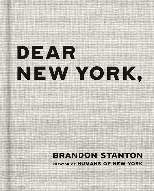 Book title: Dear New York. The cover is a light-grey, textured background with no additional imagery or illustration. Centered on the page, the title “Dear New York” appears in bold black lettering. The font is clean, simple, and modern. The overall design is minimalist and quiet, relying entirely on contrast and typography to create a refined, understated New York aesthetic.