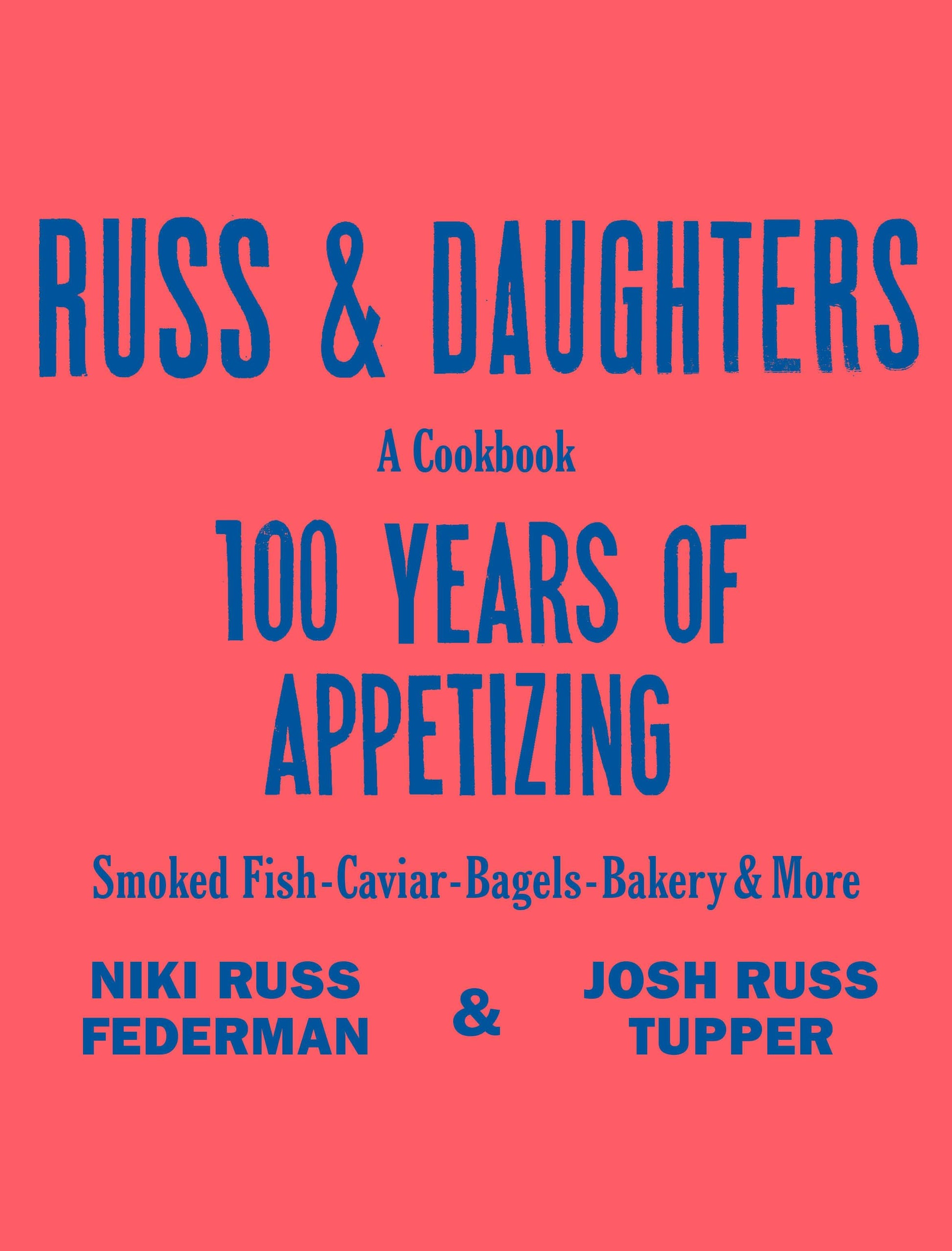 Russ & Daughters: A Cookbook, 100 Years of Appetizing. A soft pastel‑pink cover with bold royal‑blue text. “RUSS & DAUGHTERS” appears in large block letters, with “A COOKBOOK” and “100 YEARS OF APPETIZING” below. The design is minimalist, relying on strong color contrast and clean typography.