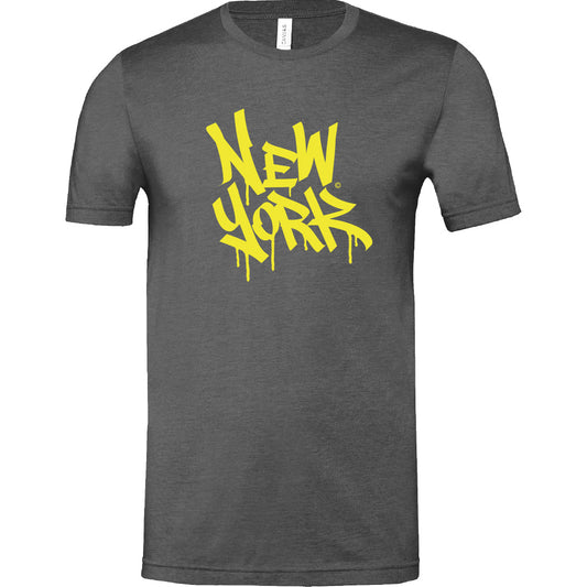 This T‑shirt features the words ‘New York’ in large graffiti‑style yellow letters that appear to drip like wet paint against a gunmetal grey background. Made from a soft cotton‑poly blend, it’s both comfortable and stylish.