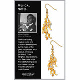 Gold musical note earrings on a card with text about jazz musicians.