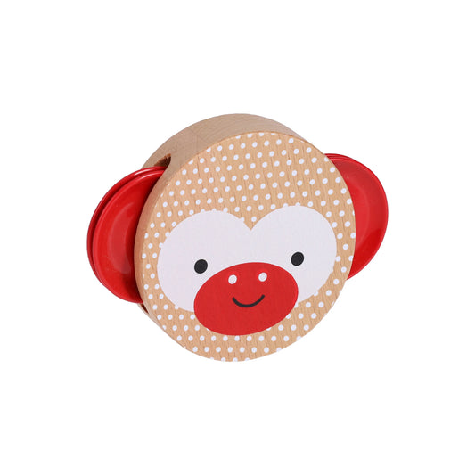 Product title: Miniature Wooden Tambourine -The design is printed with eco‑friendly, vegetable‑based inks directly onto the light natural wood, creating a clear monkey face set against a white polka‑dot background. Bright red metal jingles sit on each side like playful ears, their shine contrasting with the warm wood tones at the center.