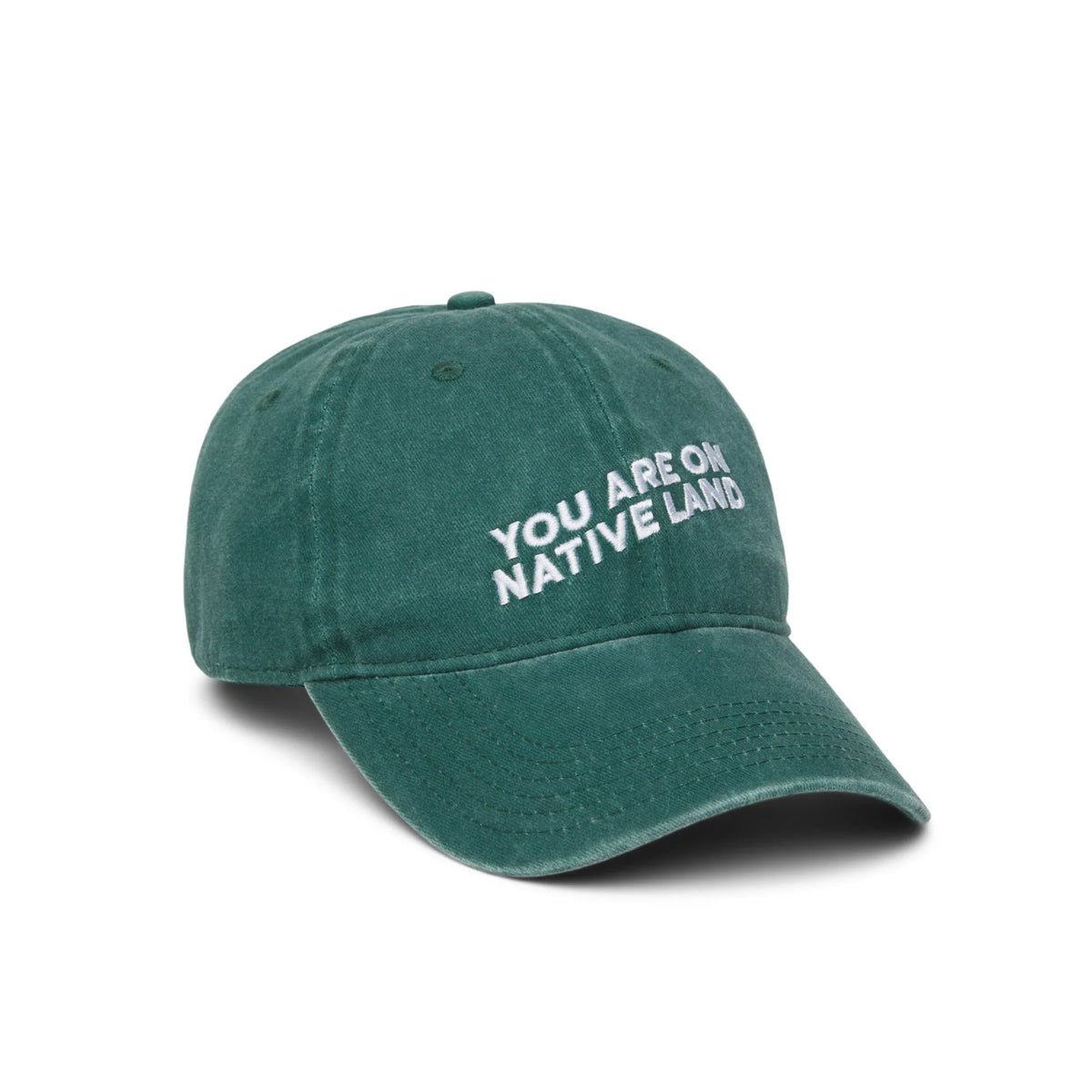 Green cap with 'YOU ARE ON NATIVE LAND' text on a white background