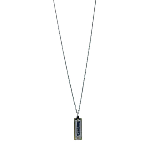 Silver necklace with a rectangular pendant on a white background