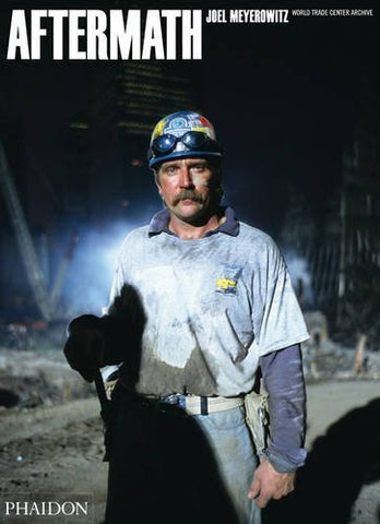 Cover of book titled Aftermath: World Trade Center Archive, cover is a photo of a worker amidst the world trade center wreckage