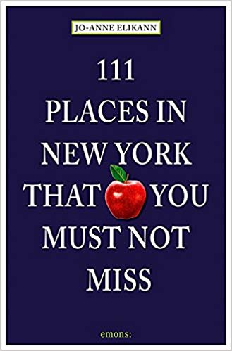 Cover of book titled 111 Places in New York that You Must Not Miss, a navy blue background with a photo of a red apple, title superimposed in white text