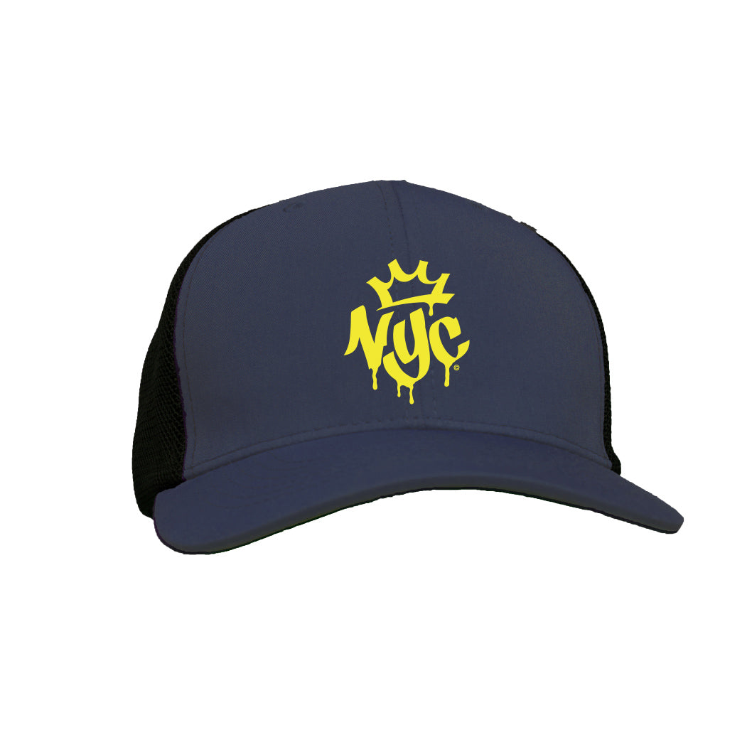 This cap is gunmetal grey and features the letters ‘NYC’ in bold, graffiti‑style bright yellow text across the front. A small whimsical crown sits above the lettering, and the spray‑paint look of the design stands out against the darker background.