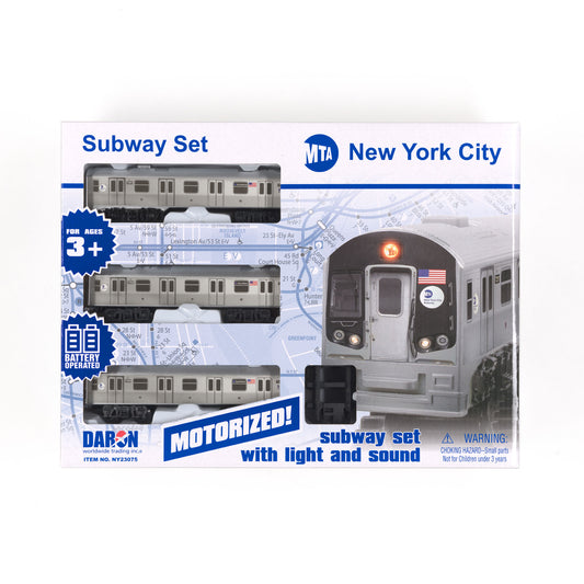 A rectangular box displays three gray subway models with black wheels set against a background of light‑blue graphics of the NYC subway map. The top panel features the MTA logo, with “New York City” printed in the upper‑right corner.