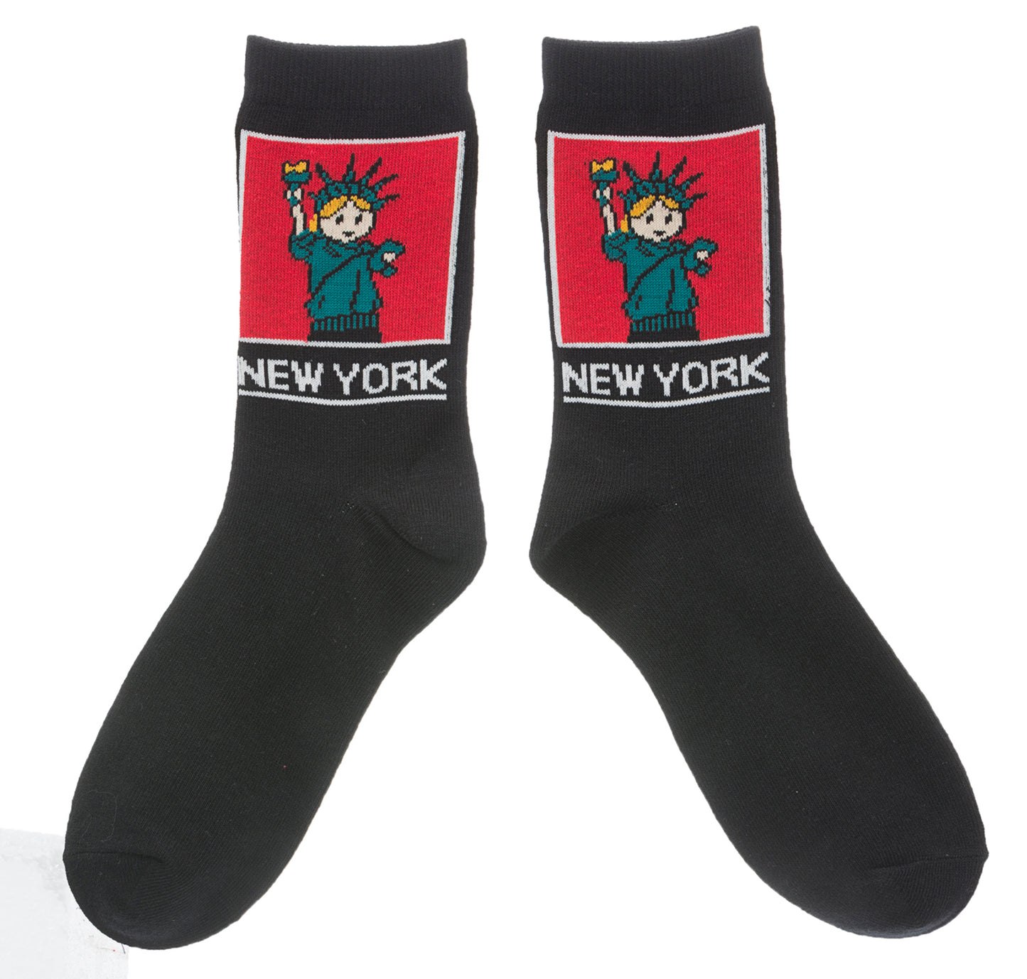 NYC Cartoon Statue of Liberty Socks 
These black crew socks feature a soft, woven cartoon image of the Statue of Liberty. On the ankle is a square red panel outlined in white, containing a friendly green Lady Liberty with small orange details in her hair and torch flame. Below the panel, “NEW YORK” appears in large, bold lettering in white. The socks feel smooth and flexible, made for comfortable everyday wear with playful New York character.