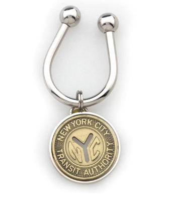 A bronze NYC subway token on silver open key ring with silver balls at the end of the U-shape opening.