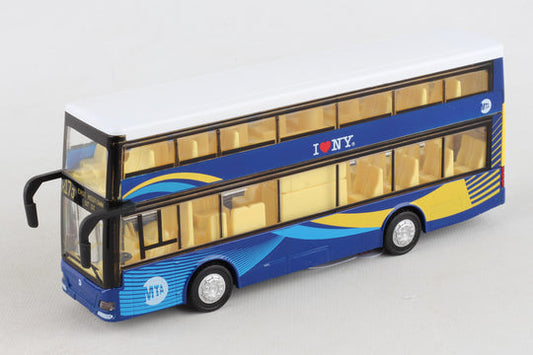 The toy is a small, rectangular double‑decker bus, about the size of an adult hand. It is bright blue with yellow accents, black wheels, and clear windows on both levels that reveal a yellow interior. The shape is boxy, with two stacked rows of windows and doors that open on the side. Small front details suggest working lights, giving it the look of a miniature city bus.