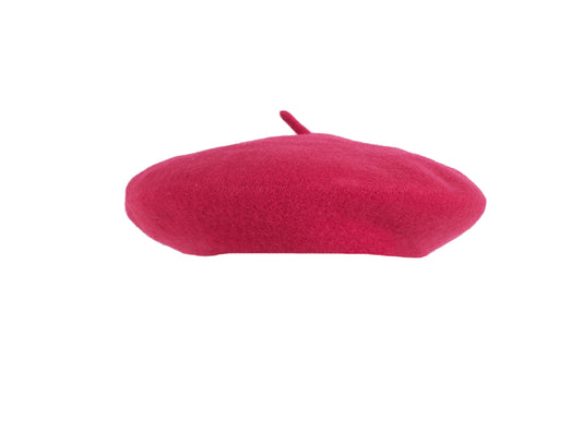 The image features a red beret made from soft, high‑quality felted wool that feels dense yet plush to the touch, with a gentle firmness that springs back when pressed. The hat has a smooth, rounded shape and a comfortable band that rests snugly around the head, allowing it to be worn tilted, pulled low for warmth, or pushed back. Overall, it offers a warm, sturdy, and luxurious feel that is both comforting and stylish. 